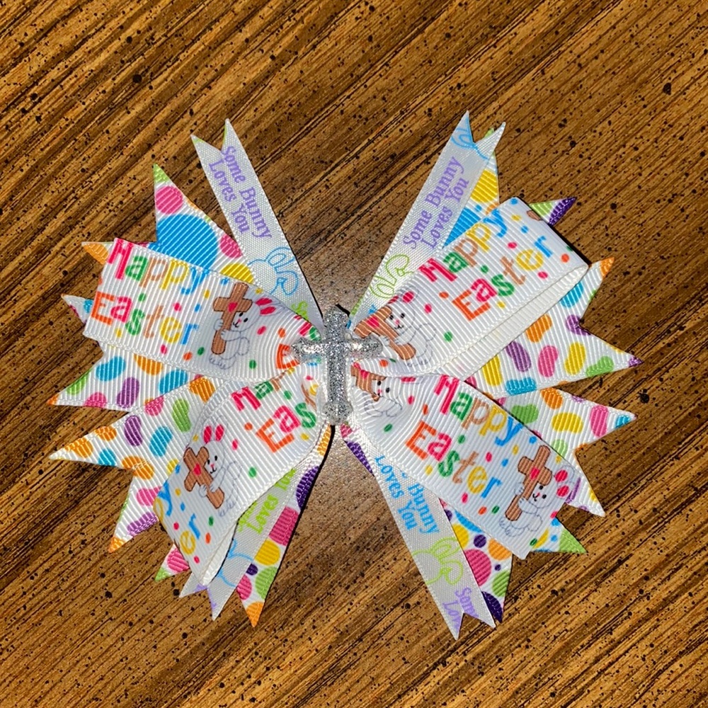 Happy Easter hair bow with a cross and says some bunny loves you
